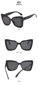 Three-way view of black cat-eye sunglasses with side metal ring accents and UV lenses