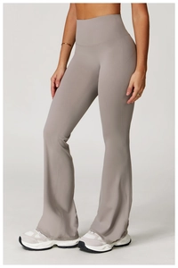 Detail view of high-waisted flared yoga pants with reinforced seams and sleek nude-feel fabric