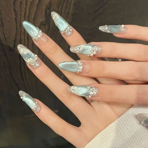 Elegant blue cat-eye press-on nails with sparkling rhinestones and luxury pearls design