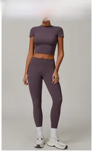 Close-up detail of eggplant purple brushed yoga set with high waist leggings and crop top