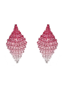 Close-up of geometric diamond-shaped earrings with pink gradient crystals and micro rhinestones