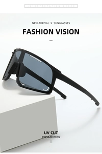 Detail of black oversized sports sunglasses with UV protection on a white block