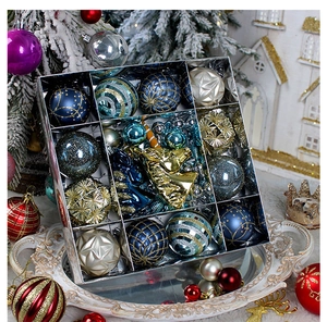 Blue and gold Christmas ornaments set with glitter, matte and painted textures on a tray