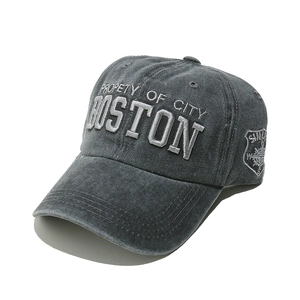 Close-up of dark grey washed cotton baseball cap with silver Boston 3D embroidery