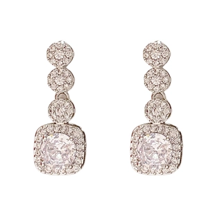 Elegant silver earrings with square zircon drops and pave-set crystals on white background