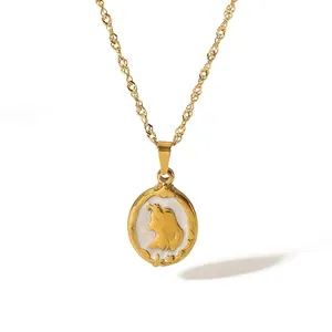 Detail showing gold vintage oval pendant with white inlay and a female profile silhouette