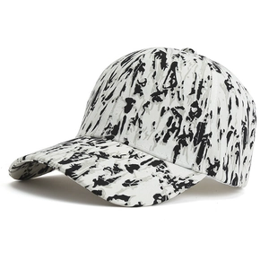 Graffiti print baseball cap with black and white abstract camouflage pattern and curved brim