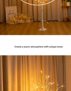 Detail of warm yellow LED lights on realistic birch tree branches with power switch cord