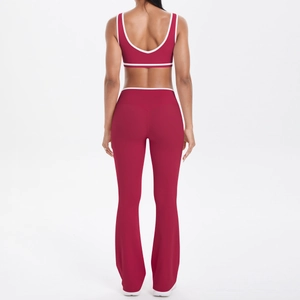 Back view of burgundy yoga set with white contrast trim on sports bra and flared pants