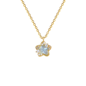 Gold star flower necklace with iridescent gemstone and sparkling pavé crystals