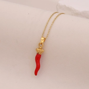 Gold stainless steel necklace with a red enamel chili pendant and crown detail