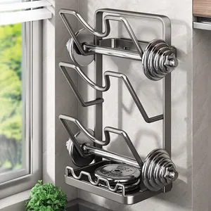 Wall-mounted grey pot lid rack and cutting board organizer in kitchen setting