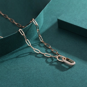 Rose gold interlocking double ring pendant necklace with crystal pave on a paperclip chain