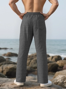 Detailed back view of dark grey striped casual trousers with elastic drawstring waist