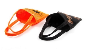 Detail of Halloween non-woven gift bags in orange spider and black text designs