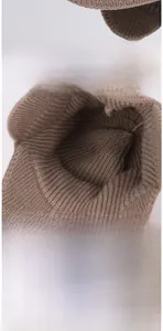 Detail view of coffee-colored knit winter hat featuring soft fleece lining and BOSTON embroidery