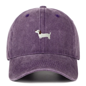 Deep purple washed cotton baseball cap with a dachshund embroidery on a white background