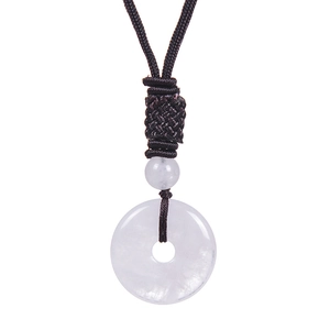 Macro detail of natural white stone pingan kou pendant with brown braided cord necklace