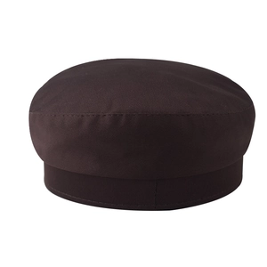 Detailed view of dark brown cotton newsboy cap with precision stitching on flat top