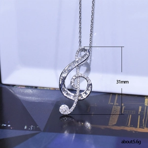 Elegant silver G-clef musical note pendant necklace with sparkling cubic zirconia pavé