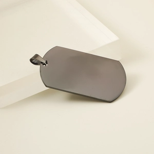 Detail view of a gunmetal grey stainless steel military dog tag pendant with a top ring