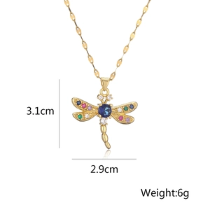 Detail showing 3.1cm x 2.9cm gold dragonfly pendant with colorful zircon crystals