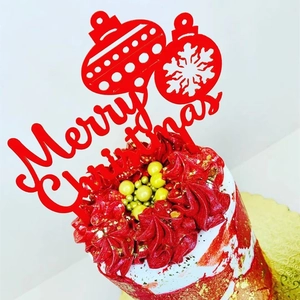 Red acrylic Merry Christmas cake topper with festive patterns for holiday party decor