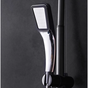 Polished silver handheld 300-hole high pressure square shower head on a gray background