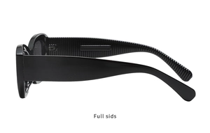 Detail view of thick black square sunglasses featuring textured non-slip wide temples