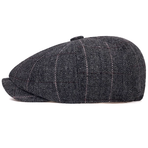 Classic dark grey herringbone newsboy cap with red plaid stripes and vintage top button