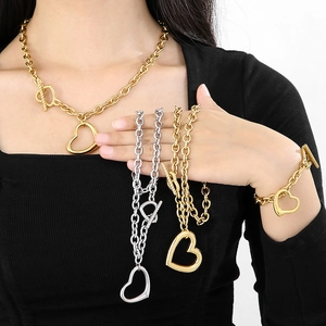 Women's titanium steel chunky chain jewelry set with hollow heart pendants and OT clasps