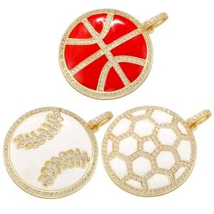 Detailed close-up of gold plated sports pendants with enamel and sparkling rhinestones