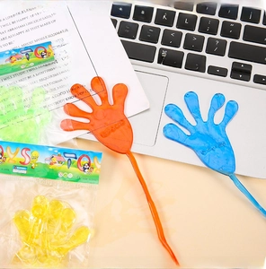 Close-up of colorful stretchy sticky hands in red, blue, yellow, and green colors