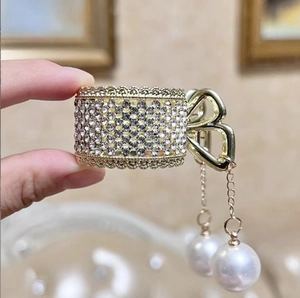 Golden butterfly hair claw clip with sparkling rhinestones and elegant long pearl tassels