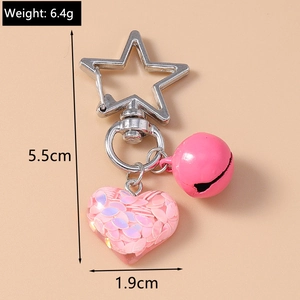 Pink heart keychain size display featuring iridescent sequins and a bell with dimensions