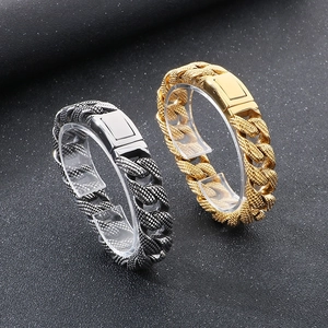 Detailed close-up of 15mm men's Cuban chain bracelet in gold and silver steel finish
