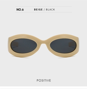 Front view of beige cat-eye polarized sunglasses with dark lenses and minimalist frame