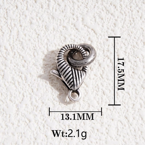 Detail view of a 17.5mm x 13.1mm silver lobster clasp with textured ribbed surface
