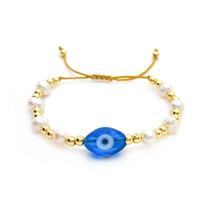 Retro freshwater pearl and gold bead evil eye bracelet with yellow adjustable cord