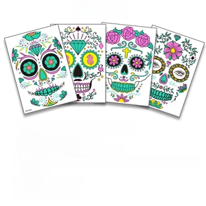 Set of four luminous Halloween facial tattoo stickers with skull and floral patterns