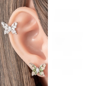 Detailed macro view of French style butterfly earring with cubic zirconia and silver plating