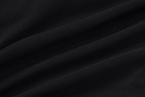 Close-up of the breathable black mesh fabric texture for the bodycon dress