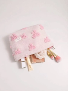 Pink plush cosmetic bag with floral tufting and zipper closure for women