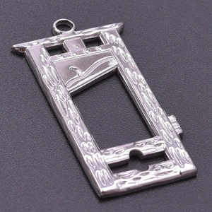 Macro view showing the silver guillotine pendant with detailed polished metal texture
