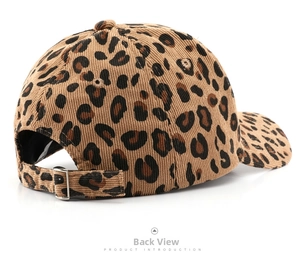 Macro view of leopard print corduroy cap texture and adjustable silver metal buckle