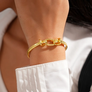 18K gold-plated oval knotted open bangle for women with a minimalist double-knot design