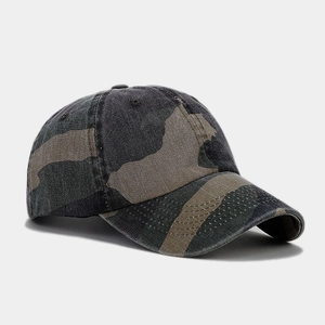 Detailed view of camouflage baseball cap with washed cotton texture and visor