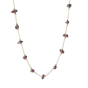 Bohemian gold chain necklace featuring natural raw red garnet stones for a vintage look