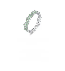 Macro shot of S925 sterling silver ring featuring mint green petals and clear zircon center
