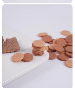 Detailed macro view of miniature simulation meat patties in brown and beige textures